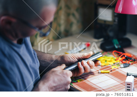 man hands repair make broken tv remote 76051811