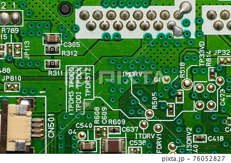 Green electronic board with radioelements close-up. Background for the theme of electronics and high tech equipment 76052827