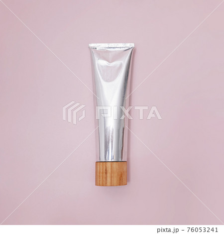 Metal tube of natural toothpaste on pink Metal tube of natural toothpaste on pink 76053241