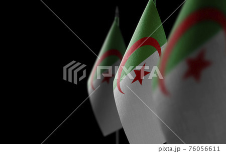Small national flags of the Algeria on a black background Small national flags of the Algeria on a black background 76056611