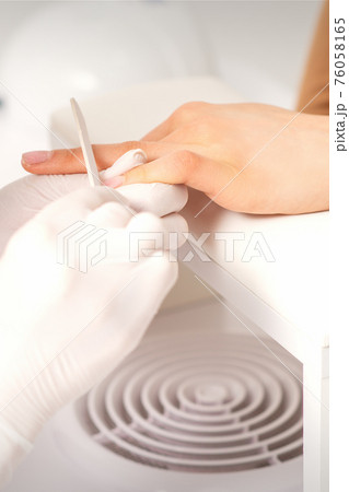 Hand receiving the nail file 76058165
