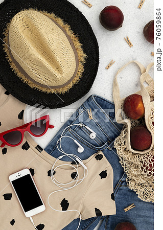 Womens summer clothes and accessories on gray background 76059864