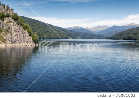 Cruising ship on the storage lake Vidraru, Arges county, Romania 76061002
