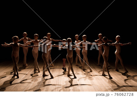 A large group of children rehearsing and dancing the ballet. A large group of children rehearsing and dancing the ballet. 76062728