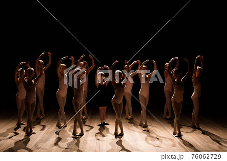 A large group of children rehearsing and dancing the ballet. A large group of children rehearsing and dancing the ballet. 76062729