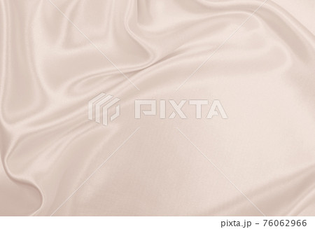 Smooth elegant golden silk or satin luxury cloth texture as wedding background. Luxurious background design. In Sepia toned. Retro style Smooth elegant golden silk or satin luxury cloth texture as wedding background. Luxurious background design. In Sepia toned. Retro style 76062966