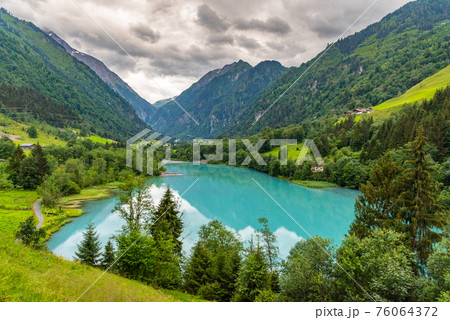 Klamsee - mountain water reservoir above Kaprun town with bright turquoise blue water, Austria Klamsee - mountain water reservoir above Kaprun town with bright turquoise blue water, Austria 76064372