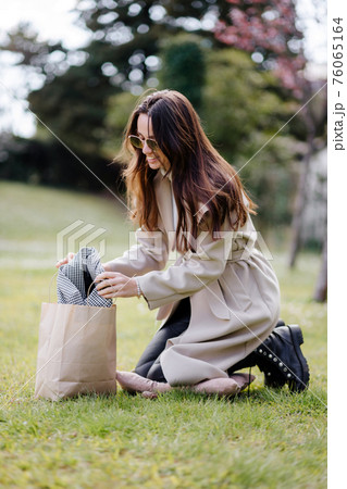 happy female shopaholic getting delivery shopping bag fashion shopping happy female shopaholic getting delivery shopping bag fashion shopping 76065164