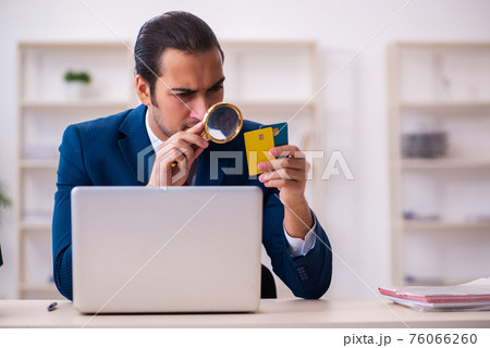 Young businessman employee in e-commerce concept Young businessman employee in e-commerce concept 76066260