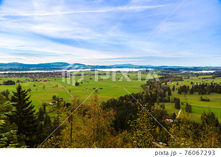 Green fields next to Neuschwanstein Green fields next to Neuschwanstein 76067293