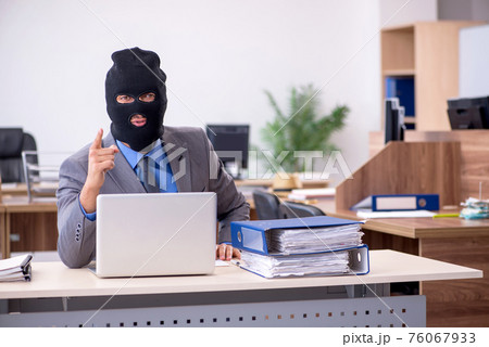 Young male employee in industrial espionage concept Young male employee in industrial espionage concept 76067933