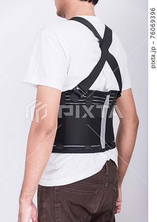 Worker Man stand wearing back support 76069396