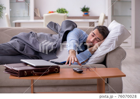 Tired businessman employee working from home 76070028