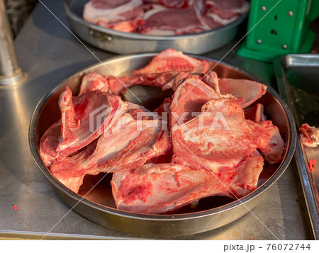 Pile of pork bone for sale at raw meat market Pile of pork bone for sale at raw meat market 76072744