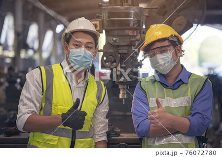 Young skillful factory worker or engineer close up portrait in factory Young skillful factory worker or engineer close up portrait in factory 76072780