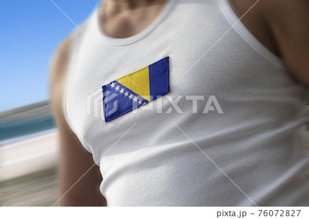 The national flag of Bosnia and Herzegovina on the athlete's chest The national flag of Bosnia and Herzegovina on the athlete's chest 76072827