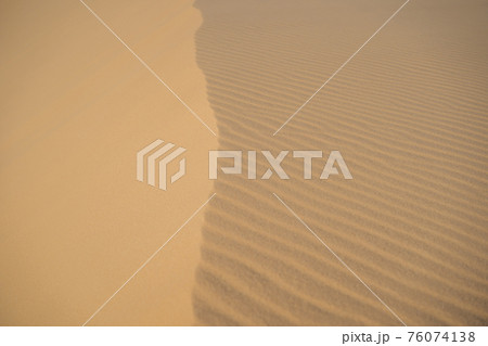 Desert - Global Warming. Huge dunes of the desert. Fine place for photographers and travelers. Beautiful structures of sandy barkhans Desert - Global Warming. Huge dunes of the desert. Fine place for photographers and travelers. Beautiful structures of sandy barkhans 76074138