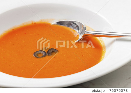 typical Spanish soup gazpacho with black olives 76076078