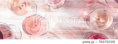 Wine panorama with copy space. Various glasses of wine 76076306