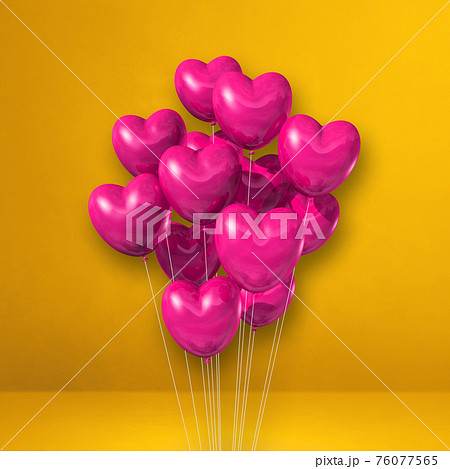 Pink heart shape balloons bunch on a yellow wall background Pink heart shape balloons bunch on a yellow wall background 76077565