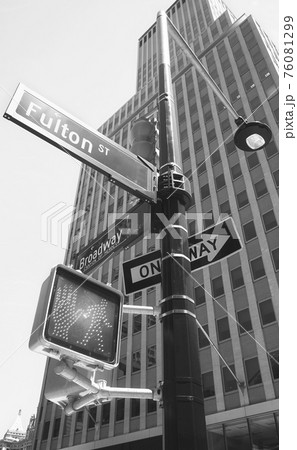 Broadway and Fulton Street signs on a traffic light post, New York City, USA. 76081299