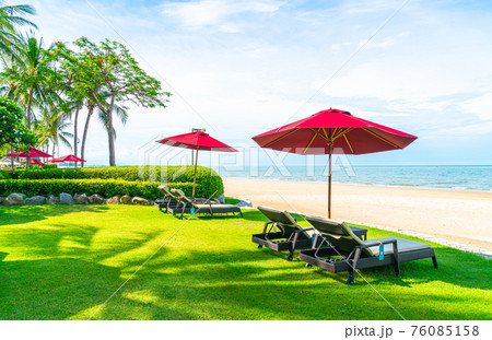 beach chair and umbrella with sea beach background beach chair and umbrella with sea beach background 76085158