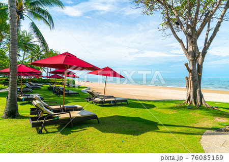 beach chair and umbrella with sea beach background beach chair and umbrella with sea beach background 76085169