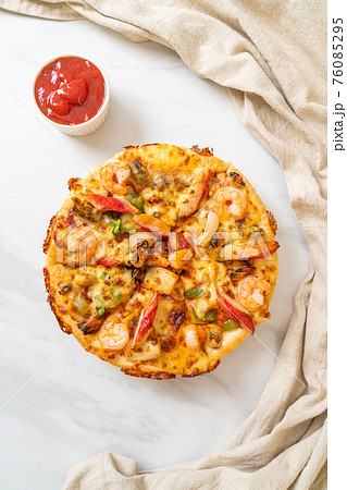 seafood pizza on wood tray 76085295