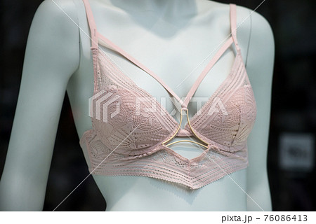 Closeup of pink bra on mannequin in a fashion store showroom 76086413