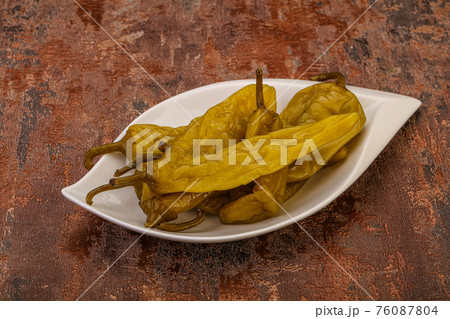Marinated spicy and hot green pepper Marinated spicy and hot green pepper 76087804