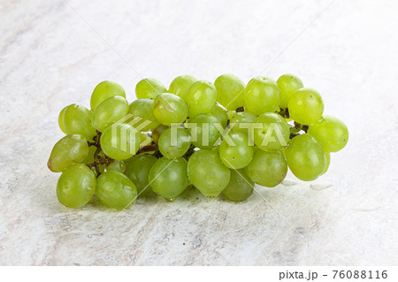 Ripe sweet green grape branch 76088116