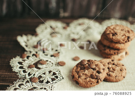 Oatmeal liver lies on a linen tablecloth. Rustic table. Vintage toning. Dietary useful cookies without gluten. Baking for Christmas and New Year .Copy space. 76088925