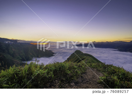 Ta Xua is a famous mountain range in northern Vietnam. All year round, the mountain rises above the clouds creating cloud inversions. Ta Xua is a famous mountain range in northern Vietnam. All year round, the mountain rises above the clouds creating cloud inversions. 76089257