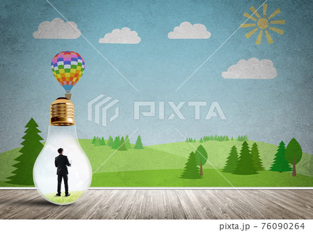 Businessman trapped in bulb 76090264