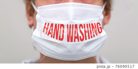 Hand washing theme with person wearing a protective face mask Hand washing theme with person wearing a protective face mask 76090517