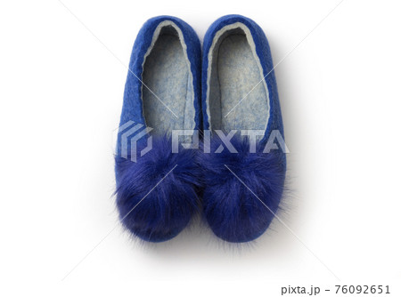 Felt slippers on white background in closeup 76092651