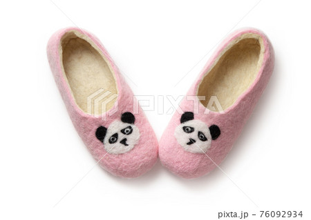 Felt slippers on white background in closeup Felt slippers on white background in closeup 76092934