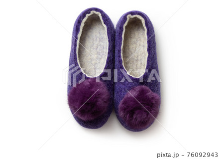 Felt slippers on white background in closeup Felt slippers on white background in closeup 76092943