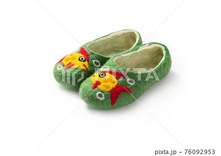 Felt slippers on white background in closeup Felt slippers on white background in closeup 76092953