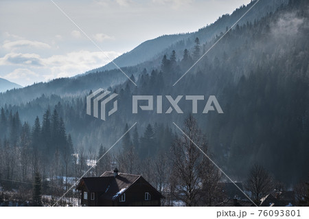 Sunrise in a Valley at Foggy Morning Mountains Landscape 76093801