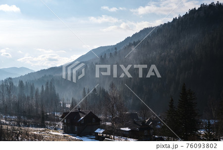 Sunrise in a Valley at Foggy Morning Mountains Landscape 76093802