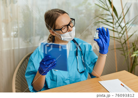 Close up portrait of Caucasian female doctor immunologist in cabinet in hospital Close up portrait of Caucasian female doctor immunologist in cabinet in hospital 76093812