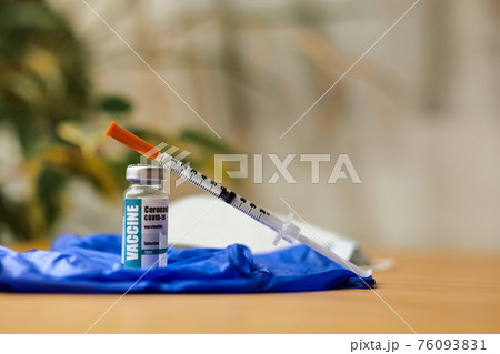 Coronavirus or COVID-19, 2019 - nCoV vaccine in a bottle with syringe Coronavirus or COVID-19, 2019 - nCoV vaccine in a bottle with syringe 76093831