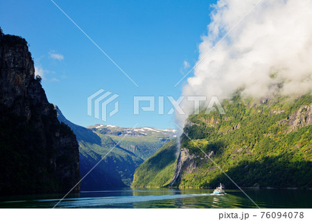 Cliff with cloud at Geirangerfjord in Norway 76094078