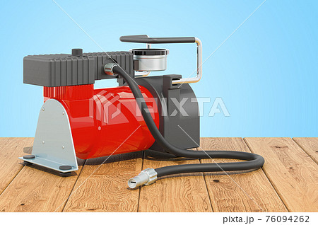 Car portable electric air compressor on the wooden table. 3D rendering 76094262