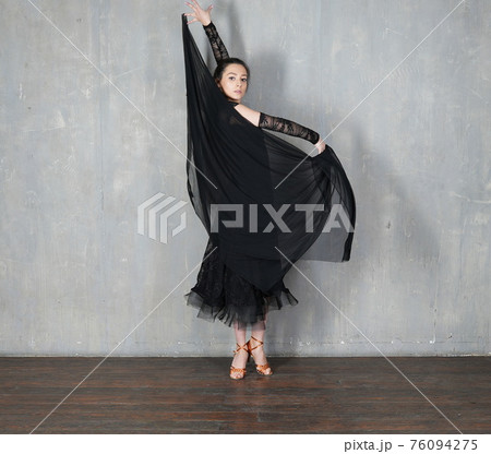 Woman dancer in motion with piece of fabric Woman dancer in motion with piece of fabric 76094275