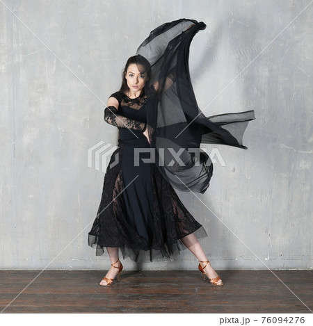 Woman dancer in motion with piece of fabric Woman dancer in motion with piece of fabric 76094276