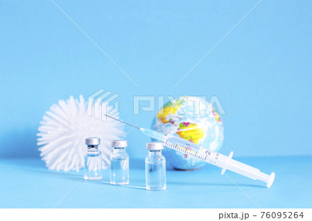 Conceptual photo for worldwide pandemic vaccination, beginning of mass vaccination for coronavirus COVID-19, influenza or flu, world immunization. Selective focus Conceptual photo for worldwide pandemic vaccination, beginning of mass vaccination for coronavirus COVID-19, influenza or flu, world immunization. Selective focus 76095264