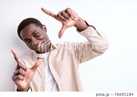 happy african man making square shape from hands 76095284