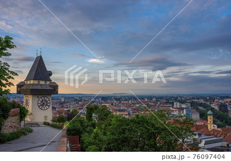 Cityscape of Graz and the famous clock tower (Grazer Uhrturm) on Shlossberg hill, Graz, Styria region, Austria Cityscape of Graz and the famous clock tower (Grazer Uhrturm) on Shlossberg hill, Graz, Styria region, Austria 76097404